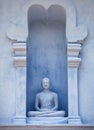 Sri Lanka, Anuradhapura. Old Buddha Statue in Exterior of the Te