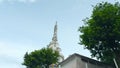 Sri Lanka, Kandy - July 29, 2023: White Tower in Sri Lanka. Action. View from below at foot of white tower of ambuluvava