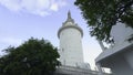 Sri Lanka, Kandy - July 29, 2023: White Tower in Sri Lanka. Action. View from below at foot of white tower of ambuluvava