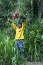 A Sri Lanka man selling flowers on the roadside near Nuwara Eliya.