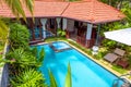 Nice villa at tropical hotel. Idyllic scenic courtyard with swimming pool Royalty Free Stock Photo