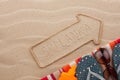 Sri Lanka pointer and beach accessories lying on the sand Royalty Free Stock Photo