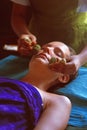 Sri Lanka: A woman enjoying a ayurevedic herbal stamp massage near Unawatuna