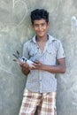 A Sri Lankan boy holding one of his pet pigeons at Negombo on the east coast.