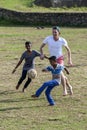 Sri Lankan boys and foreign men play a game of football at Galle in Sri Lanka.