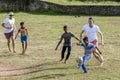 Sri Lankan boys play football with foreign men inside the old Dutch Fort at Galle in Sri Lanka.