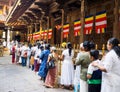 Sri Lankan Buddhist devotees at the Temple of Sacred Tooth Relic