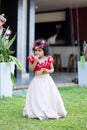 sri lankan child in traditional dress in garden
