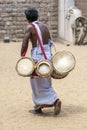 A Sri Lankan drummer walks past the the Mahavihara at the ancient site of Anuradhapura in Sri Lanka.