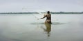 Fisherman fishing with net