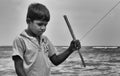 Sri lankan small boy playing at the beach.