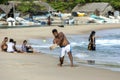 A man playing cricket on Arugam Bay beach in Sri Lanka. Royalty Free Stock Photo