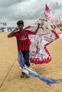 A Sri Lankan man prepares a kite for take off from Negombo beach in Sri Lanka.