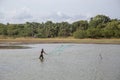 Sri Lankan man throwing fishing net