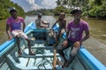 Sri Lankan men and boys take a boat ride through one of the lagoons at Negombo.