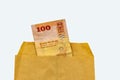 100 Sri Lankan rupee banknote closeup in paper envelop isolated