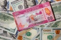 20 Sri Lankan rupees on a background of 100 dollar bills
