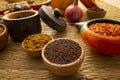 spices ingredients creative concept black pepper cardamom nutmeg mustard seeds spicy curry powder Royalty Free Stock Photo