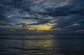 Sri-Lankian beautiful sunset over the sea, waves and cloudy dark sky Royalty Free Stock Photo