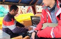 Srinagar, India - April 23, 2017 : Local seller trying to sell jewery to tourist in Dal lake Royalty Free Stock Photo