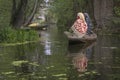 Kashmiri woman Indian on Dal Lake early morning locals using a small boat for transportation in Dal Lake, Kashmir, India