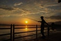 Srinagar, Jammu and Kashmir, India: Dated- April 18, 2019: A person fishing on the banks of Dal Lake in Kashmir. A person holding