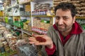 Shop keeper in Kashmir, India shows loose saffron