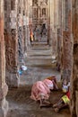 Pilgrims rest on the ground in Ranganathaswamy Temple, India
