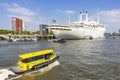 The SS Rotterdam on its permanent location on the quay of Katendrecht in Rotterdam, with some tender boats for transporting passen