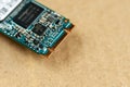 SSD disk close up, selective focus on brown kraft background. Royalty Free Stock Photo