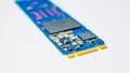 SSD hard drive NVMe version for slot M.2 laid on white background and narrow focus at pinout Royalty Free Stock Photo