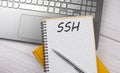 SSH text written on a notebook on the laptop