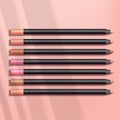 Vector Black Ultra Slim Lip Pencil / Liner / Brow Pencil / Color Pencil  in Pink Background Royalty Free Stock Photo