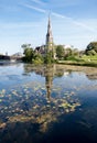 St Alban`s Anglican Church in Copenhagen and its reflection in the lake on a nice summer day