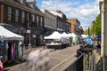 St Albans-UK - 19 May 2021 - People shopping and walking on busy retail high street with market stalls and shops