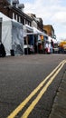 St Albans-UK - 19 May 2021 - People shopping and walking on busy retail high street with market stalls and shops