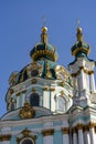 St. Andrew\'s church domes with golden cross on blue sky background. Kyiv city, Ukraine Royalty Free Stock Photo