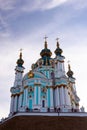St. Andrew`s Orthodox Church on St. Andrew`s Uzvoz in the Ukrainian capital, Kiev. Golden domes against the blue sky Royalty Free Stock Photo