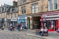 Main street medieval city St Andrews with shopping people