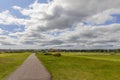 A scenic view of the St Andrews golf course, where tradition meets natural beauty. The path winds through vibrant greens Royalty Free Stock Photo