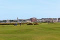 A group of golfers playing the most famous links golf course in the world