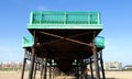 St Annes Pier Underside View Green Railings, Rusty Structure, and Sunny Beach Scene Royalty Free Stock Photo
