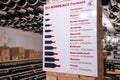 Advertisement sign board mounted on wooden column in modern wine store