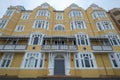 St Aubyns Mansions on Kings Esplanade, Hove, East Sussex, UK. Restored mustard coloured block of flats overlooking the sea