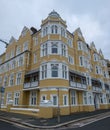 St Aubyns Mansions on Kings Esplanade, Hove, East Sussex, UK. Restored mustard coloured block of flats overlooking the sea