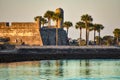 Beautiful view of Castillo de San Marcos Fort, sea and palm trees at Old Town in Florida`s Historic Coast . Royalty Free Stock Photo