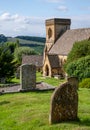 St Barnabas Anglican church, surrounded by a graveyard, in the picturesque English Cotswold village of Snowsill, Gloucestershire. Royalty Free Stock Photo