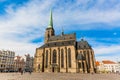 St. Bartholomew`s Cathedral in the main square of Plzen with blue sky and clouds in sunny day. Czech Republic, Pilsen. Famous lan Royalty Free Stock Photo