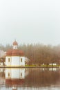 St. Bartholomews church in the morning fog, Konigsee lake, Bavaria, Germany. Alpine lake with church on the bank. Royalty Free Stock Photo