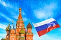 St. Basil Cathedral at Moscow Red Square with Russian flag. Summer sunny day. World famous Russian Moscow landmark Royalty Free Stock Photo